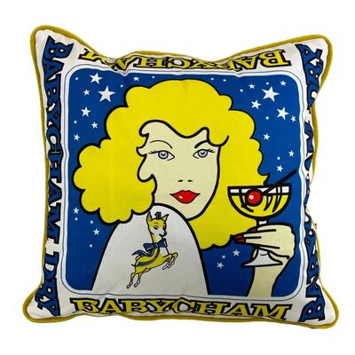 Cushion with blonde haired figure holding Babycham cocktail