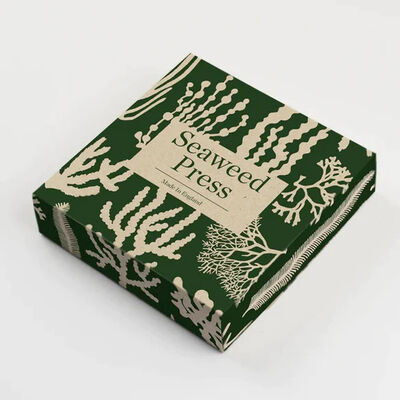 Green box with light brown seaweed patterns on it.