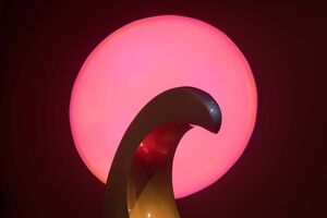 Sculpture in dim light, backlit in pink