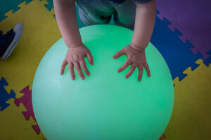 Hands on a big bouncy ball