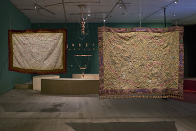 Two large tapestries hanging from the ceiling.