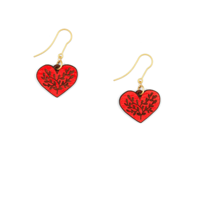 Two red heart shaped earrings with gold hoops and Hygge design 