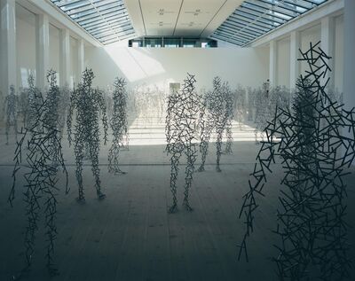 Sculptures of people in a room