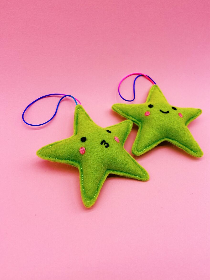 Two yellow star decorations with cute faces.