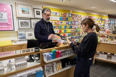 Baltic Shop staff and visitor at the till