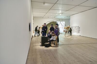 Young people interacting with artwork