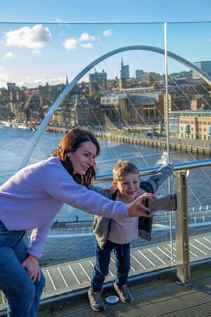 Person and child taking a selfie on Level 4 terrace