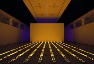 Dark room with letter projected onto the floor