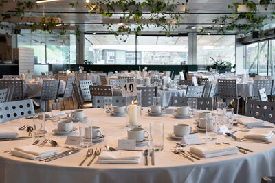A set table with a white table cloth.
