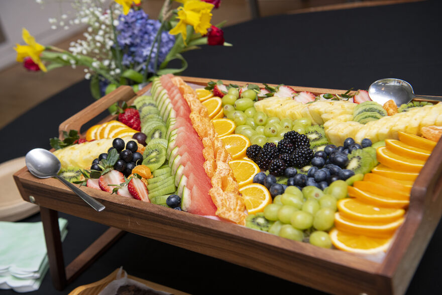 Wooden tray full of colourful fruits.