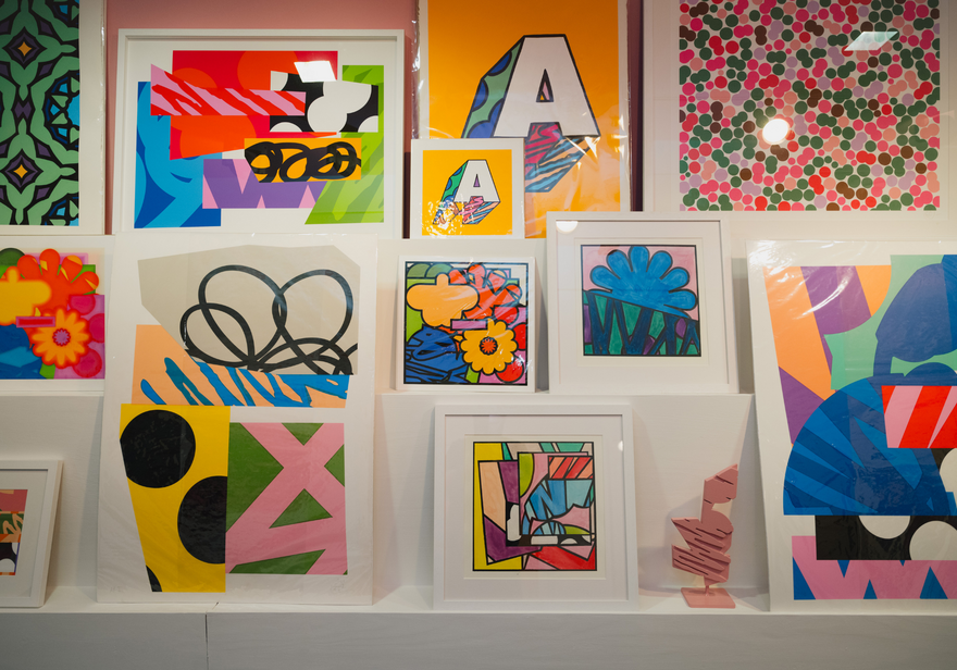 Collection of framed and unframed, colourful and bold prints.