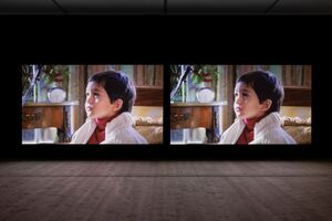 Double image of young child on projected film