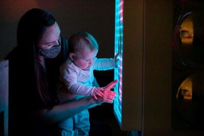 Baby touching light screen