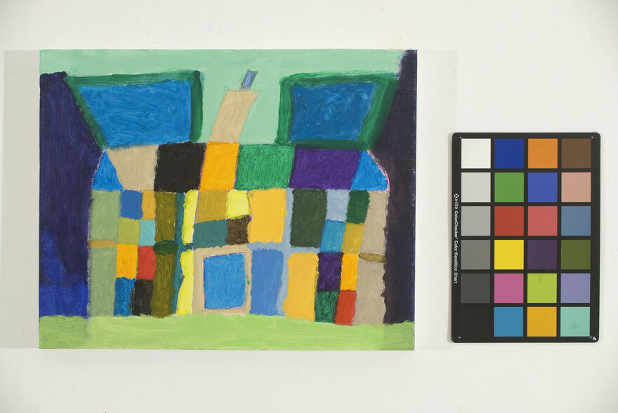 A colourful painting of a house next to a palette, which shows the colours used.