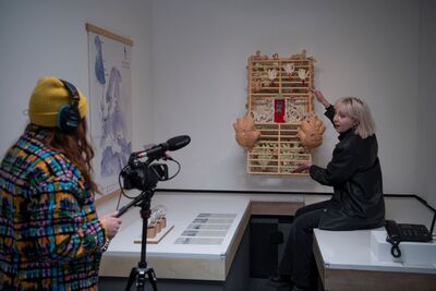 Person filming exhibition content for Baltic Archive