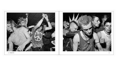 Young people wearing punk clothing dancing in a club setting. 