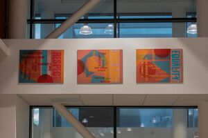 3 brightly coloured abstract artworks above a window or entrance