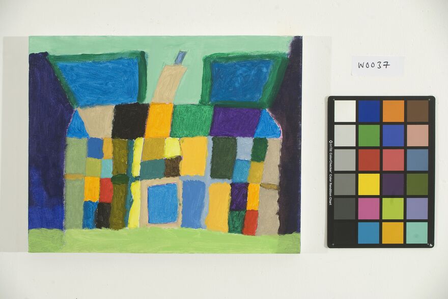 Photo of an abstract painting of a house in bright primary colours with a colour pallet next to it.