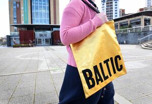 Person wearing Gold Baltic Tote Bag